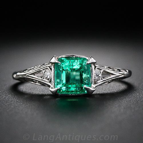 Diamond Engagement Ring With Emerald Side Stones