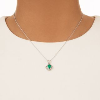 Estate Oval Emerald in Baguette Diamond Pendant