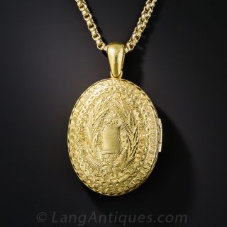 Victorian Engraved Oval Locket with Cross and Floral Motifs
