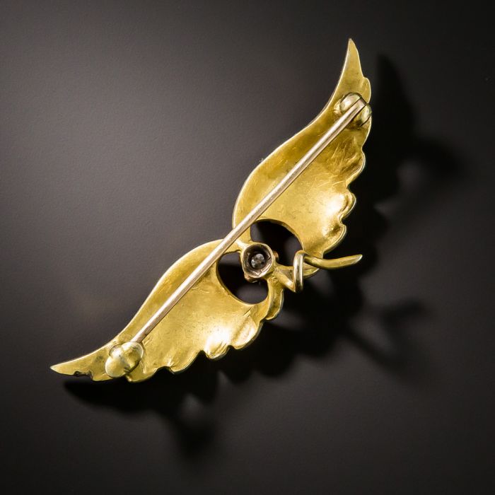 Wing brooch deals