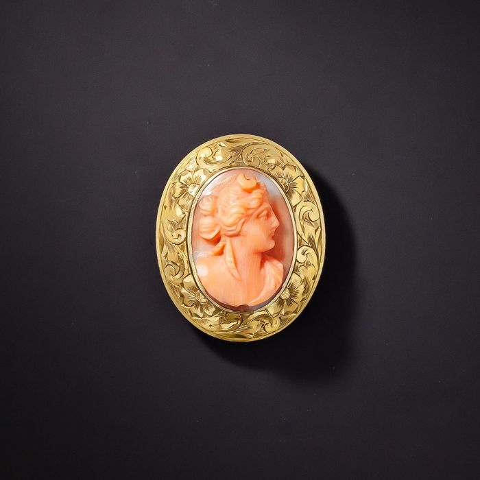 Coral store cameo brooch