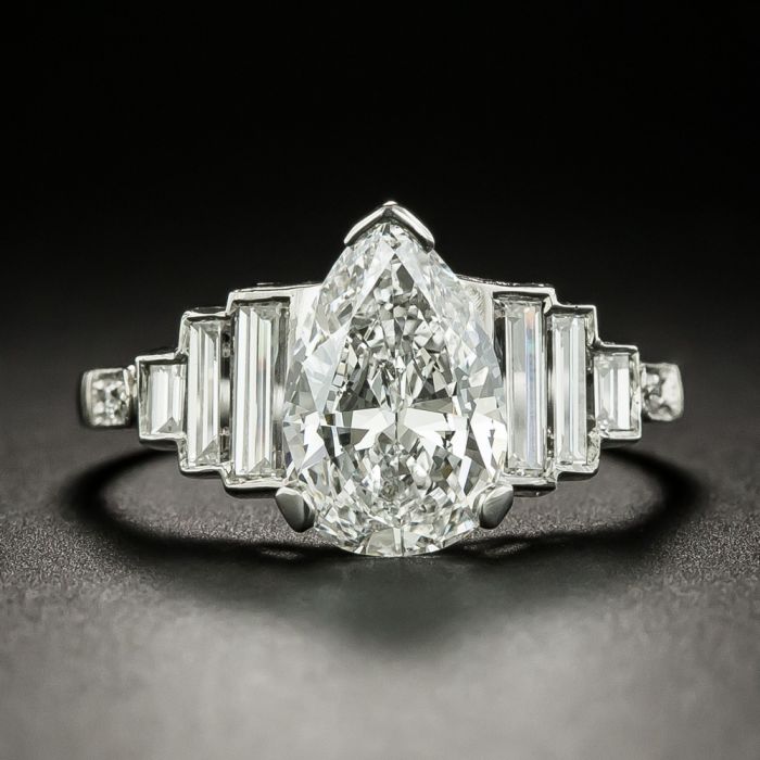 8ct Pear-shape Center Ring with .50ct Baguettes on the sides. Center stone  size: 17x11mm. F32-12-CZ-14K - Fantasia by DeSerio