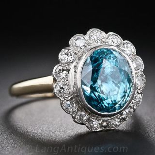 Blue Zircon and Diamond Halo Ring