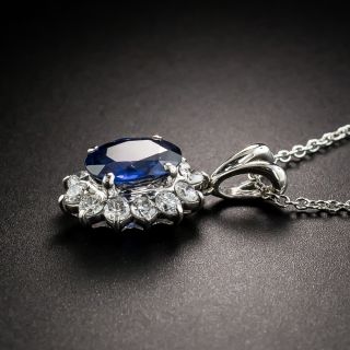 Estate Platinum Sapphire and Diamond Halo Pendant Necklace