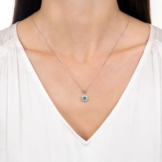 Estate .27 Carat Emerald and Diamond Halo Pendant