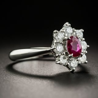 Estate .66 Carat Ruby Platinum Diamond Halo Ring