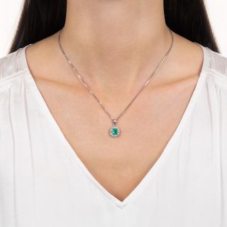 Estate .73 Carat Emerald and Diamond Halo Pendant
