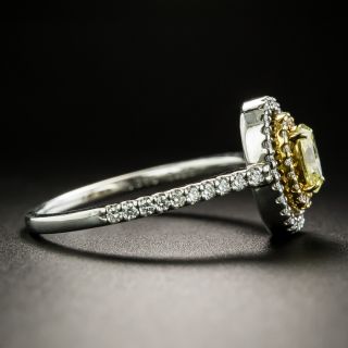 Fancy Yellow .38 Carat Oval-Cut Diamond Halo Ring