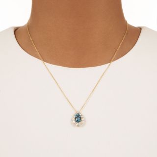 Fine Pear Shaped Aquamarine and Diamond Halo Pendant