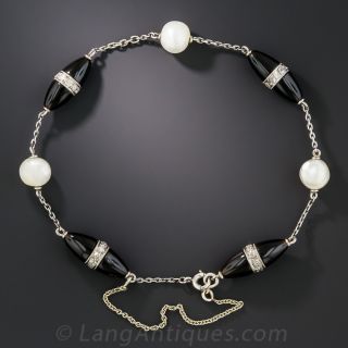 French Art Deco Platinum Onyx Diamond and Pearl Torpedo Bracelet