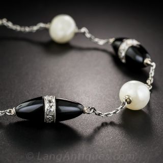 French Art Deco Platinum Onyx Diamond and Pearl Torpedo Bracelet
