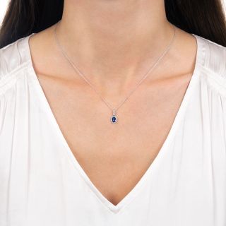 Petite Oval .45 Carat Sapphire and Diamond Halo Pendant