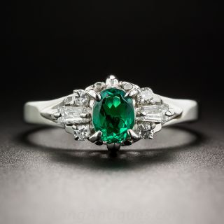 Platinum .35 Carat Oval Emerald and Diamond Ring