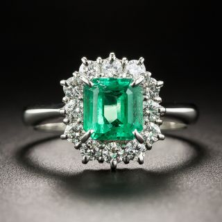 Platinum .96 Carat Emerald and Diamond Halo Ring