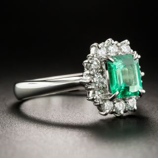 Platinum .96 Carat Emerald and Diamond Halo Ring