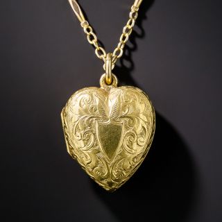 Puffed engraved heart locket with cable and dash chain