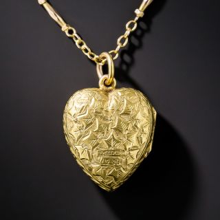 Puffed engraved heart locket with cable and dash chain