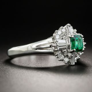 Small Platinum Emerald and Diamond Halo Ring