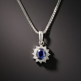 Small Platinum Sapphire and Diamond Halo Pendant - 1