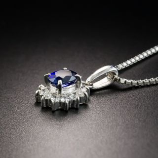 Small Platinum Sapphire and Diamond Halo Pendant