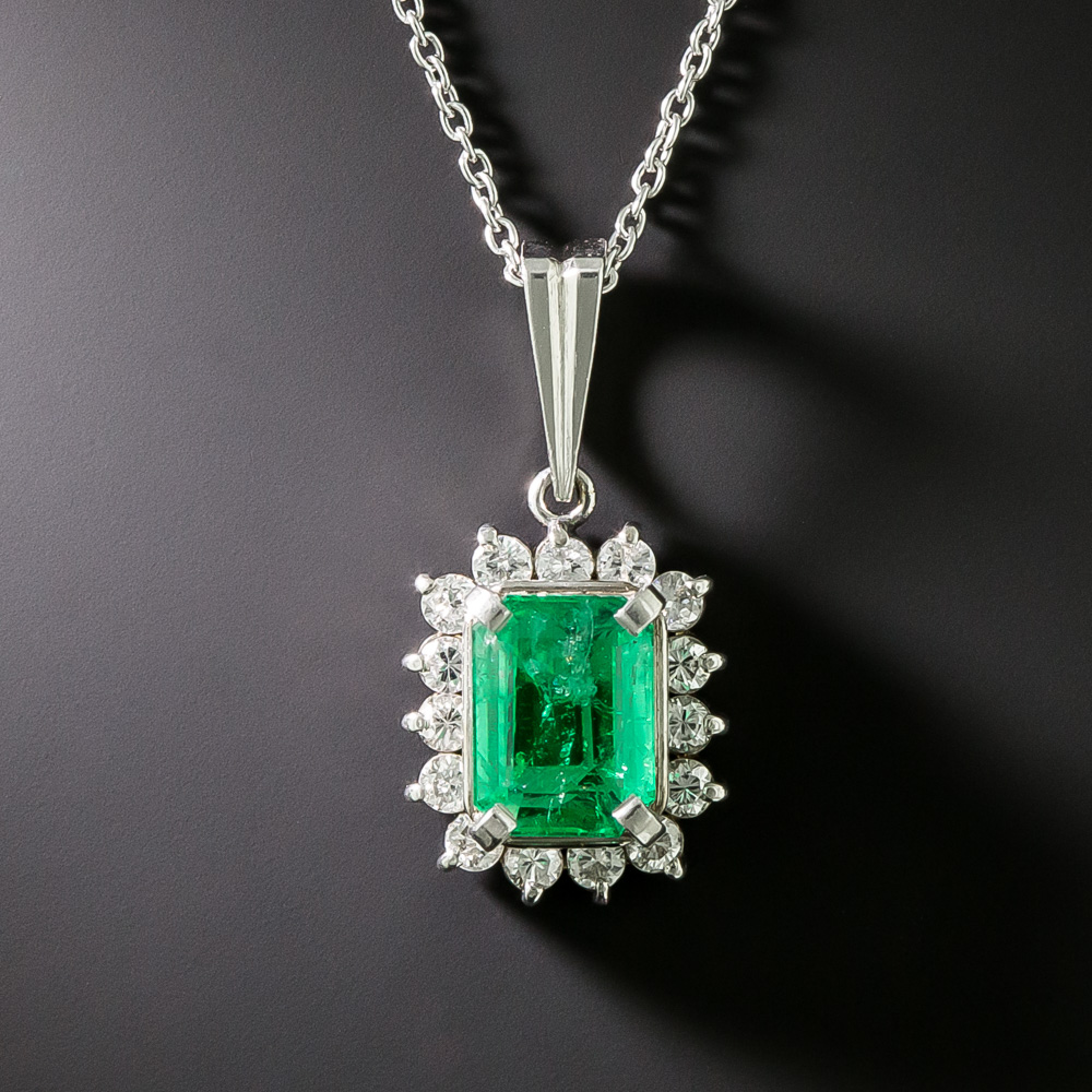 .76 Carat Emerald and Diamond Halo Pendant