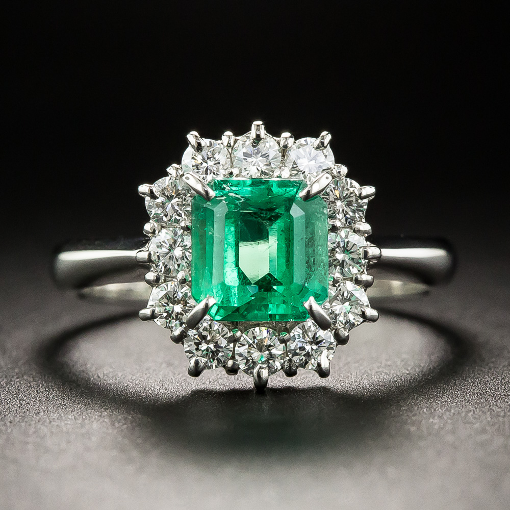 Platinum .96 Carat Emerald and Diamond Halo Ring
