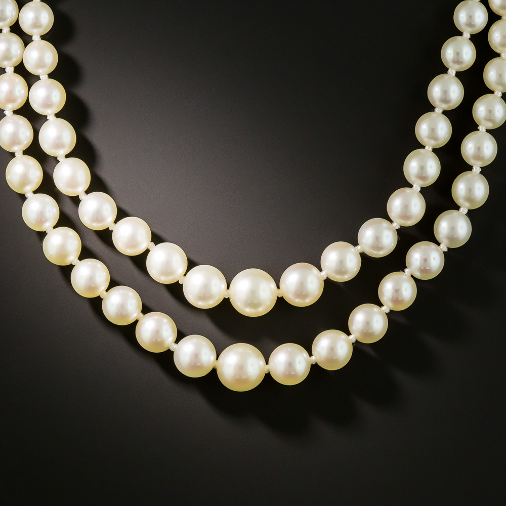 Lot - Double Strand Pearl Necklace with Platinum, Emerald, and